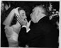 Mimi receiving a kiss from Chief Justice Fred Vinson at her wedding to Thomas Richard Gronlund, August 7, 1953. This is thought to be the last picture taken of Vinson who died of a heart attack a month later, September 8, 1953.